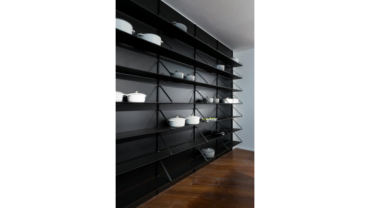 Fenix at Milan Design Week black wall and shelves