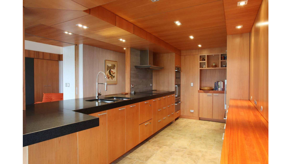 Preston Stevens designed the kitchen as a timber island in the middle of the house.