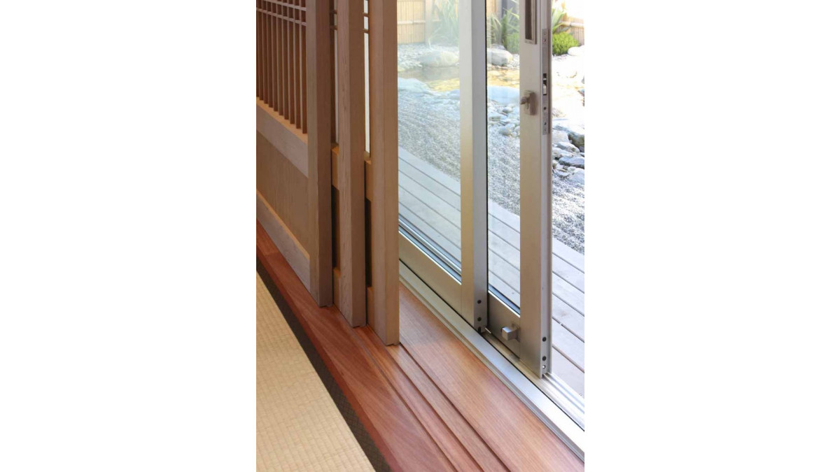 The screen doors had translucent Shoji paper fixed to the outside in traditional Japanese style. The Shoji screens in natural Cedar run on grooves routed into the timber reveals, with Metro sliders beyond.