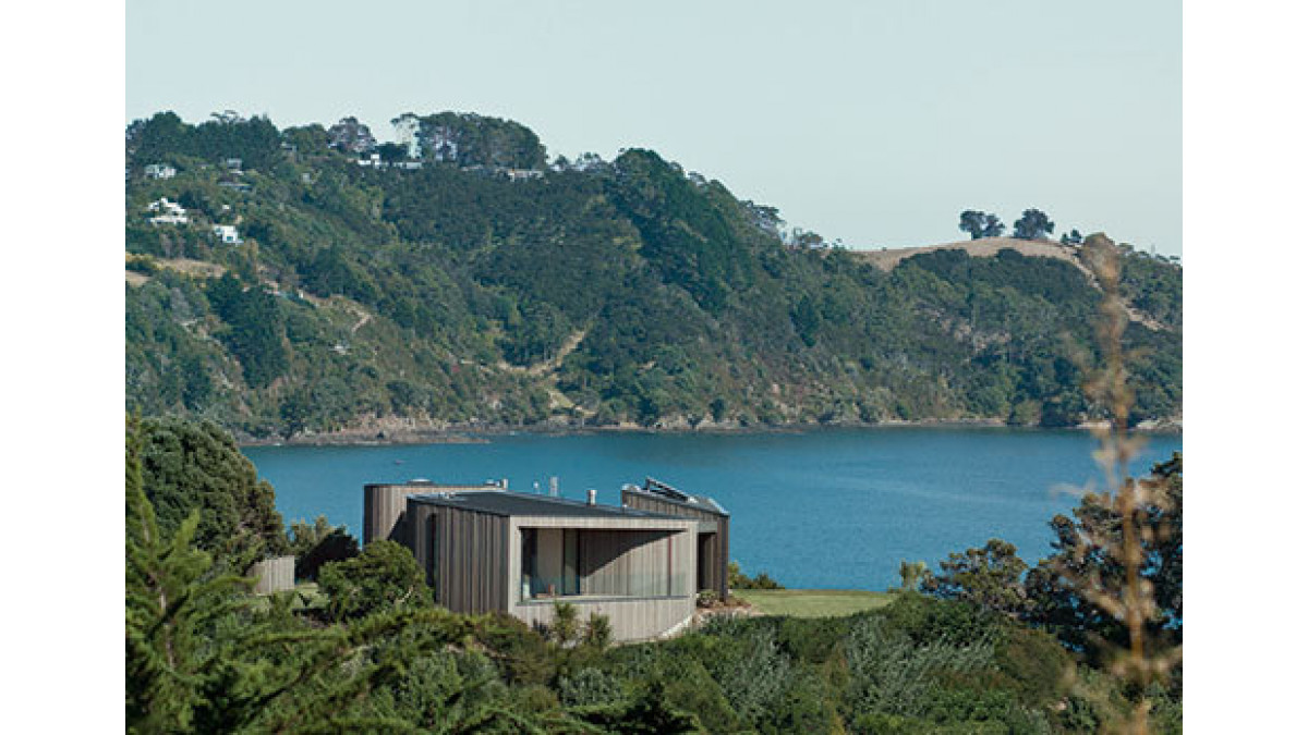 The windows and doors frame slices of a dramatic 270-degree panorama that takes in Onetangi Beach and a series of rocky headlands. (Photo: Mark Smith)
