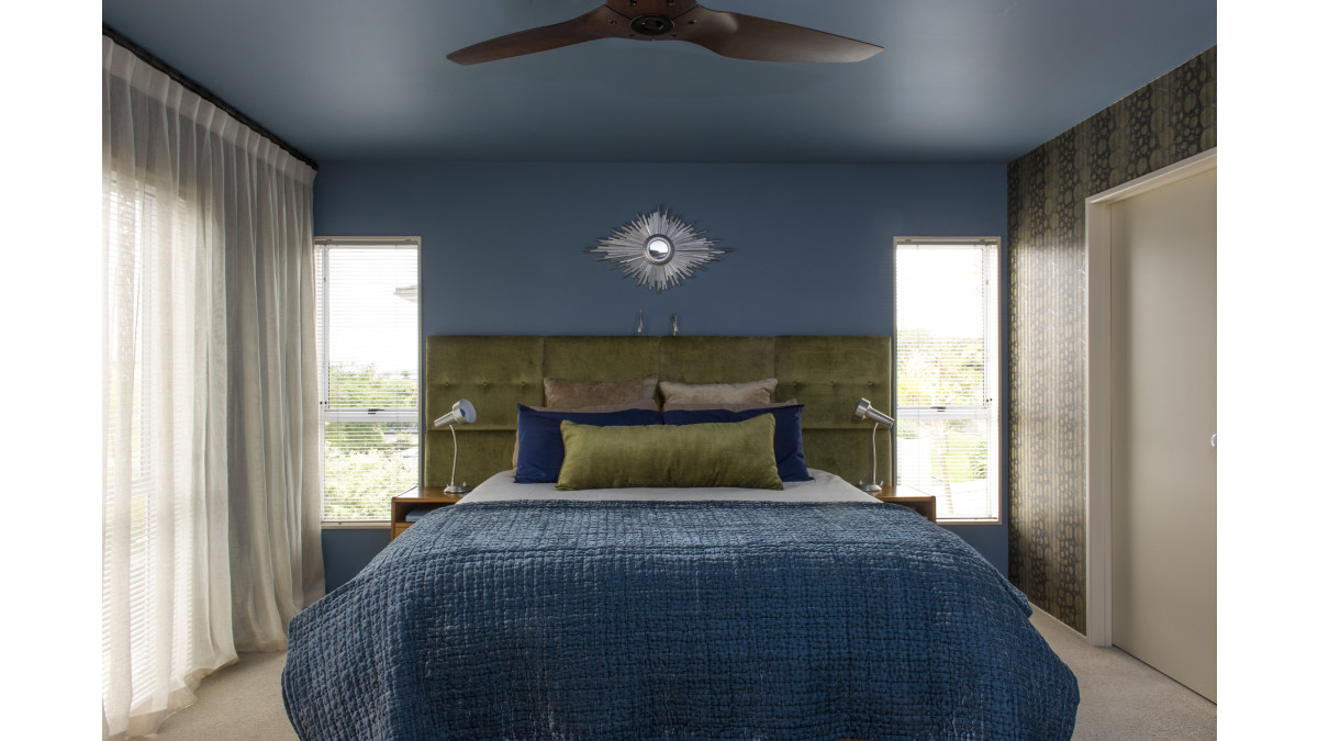 Continuing the wall colour, Resene Seachange, onto the ceiling lowers the ceiling and makes the room feel cosier. An ideal option for bedrooms to create a cocoon of colour.