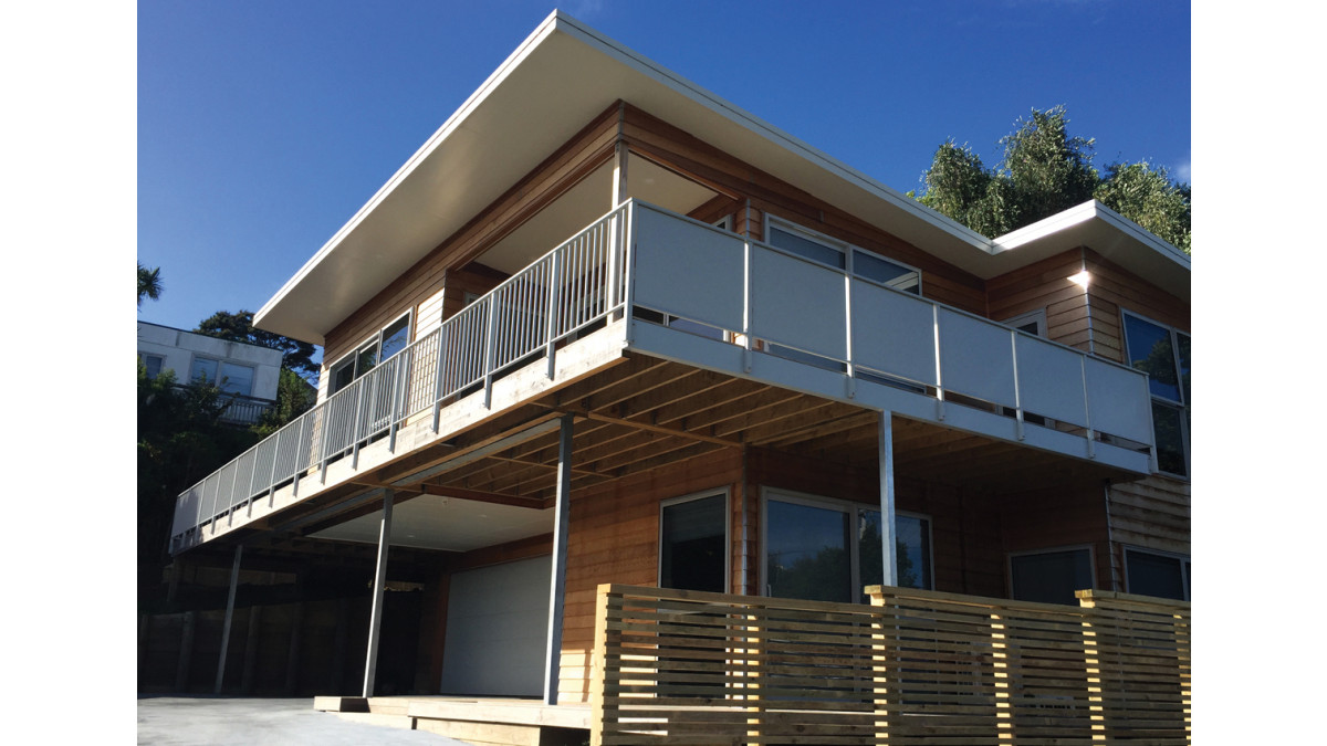 Aluminium infill panels in 'Vista' provide privacy, while 'Settler' balusters offer view and light.