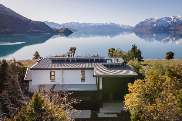 Seamless Roofing Design for an Award-Winning Lakeside Home