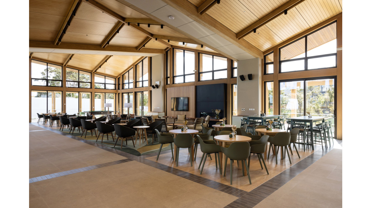 The exposed timber structure adds warmth to the interior of the Botanic Silverdale Clubhouse.