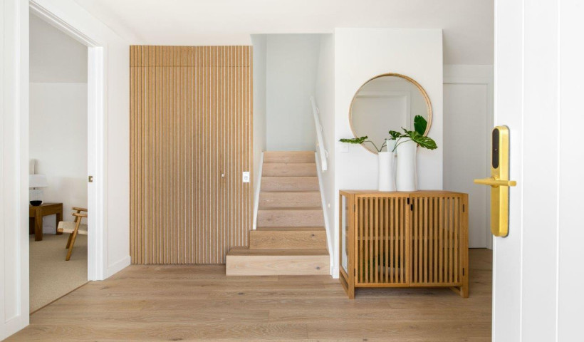 Clever Use of Vertical Wooden Slats Turns Affordable Powerglide Elevator into a Design Feature