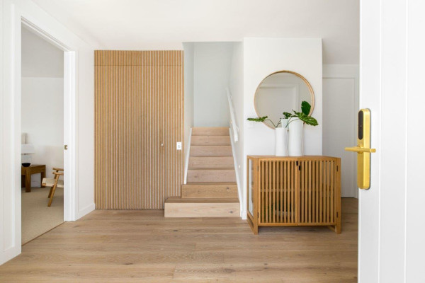 Clever Use of Vertical Wooden Slats Turns Affordable Powerglide Elevator into a Design Feature