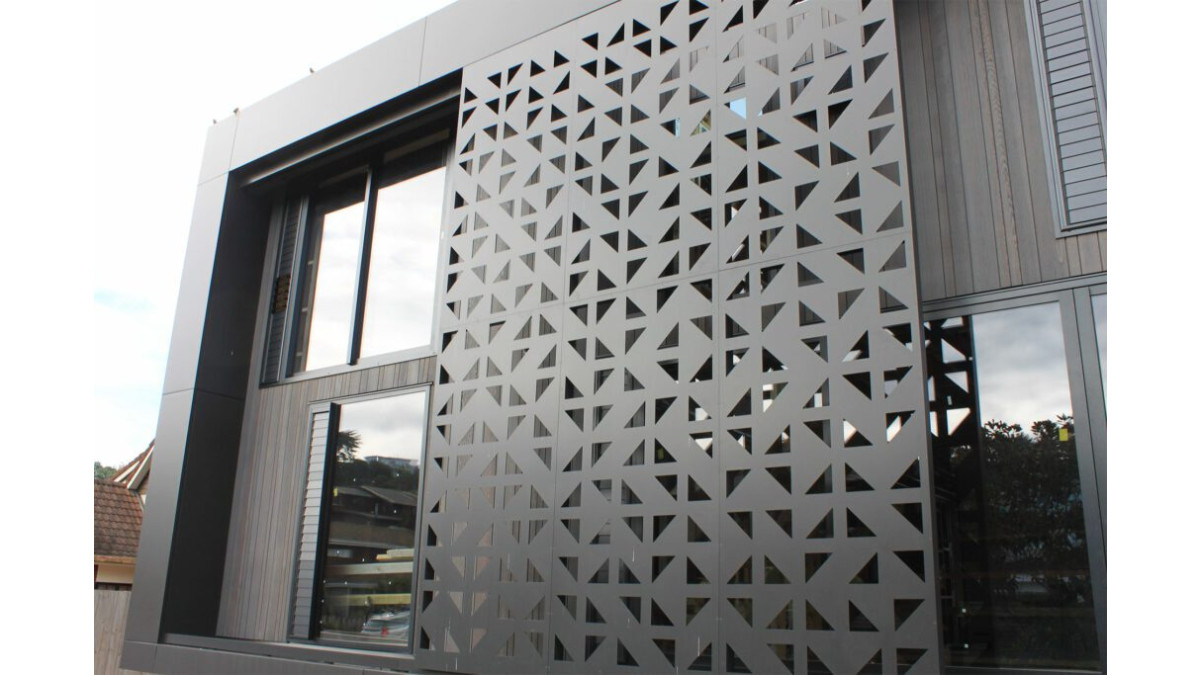 The perforated ACMF privacy screens were used to create a bespoke facade feature.<br />
