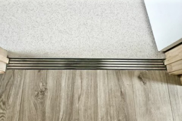 Innovative Drainage Solutions: Transforming Intertenancy Floor Protection with Jesani Door Channels